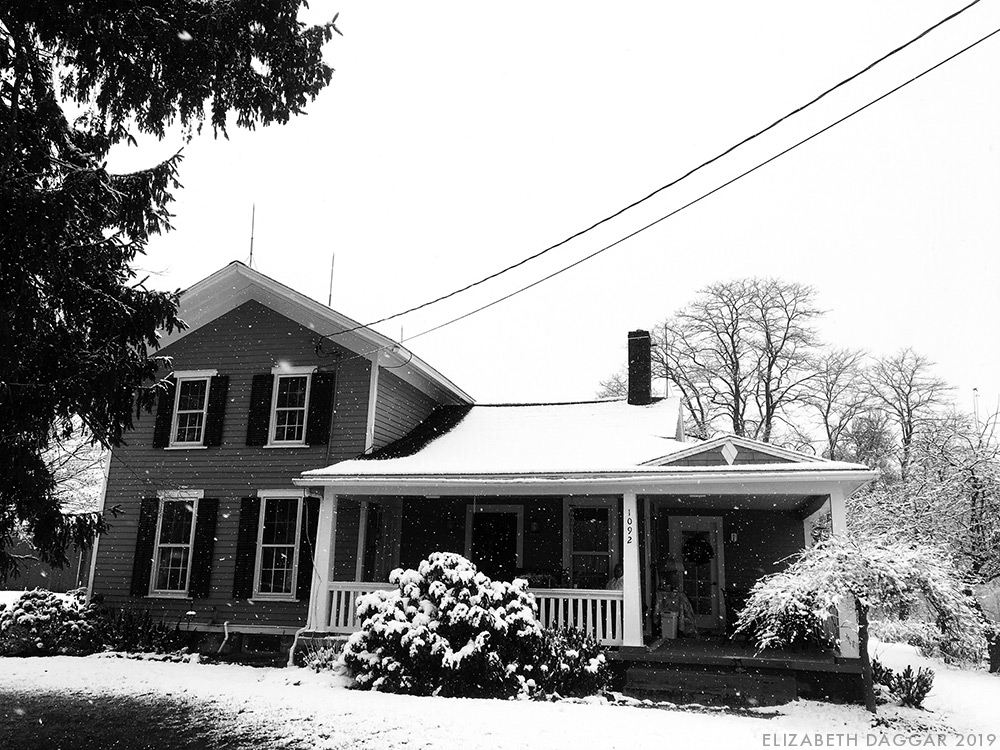 the house at the Farm, blanketed in easy snow (b&w photo)